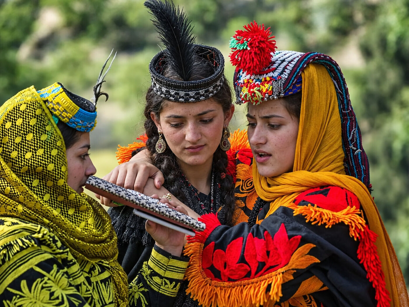 Kalasha musicians playing drums during a gathering